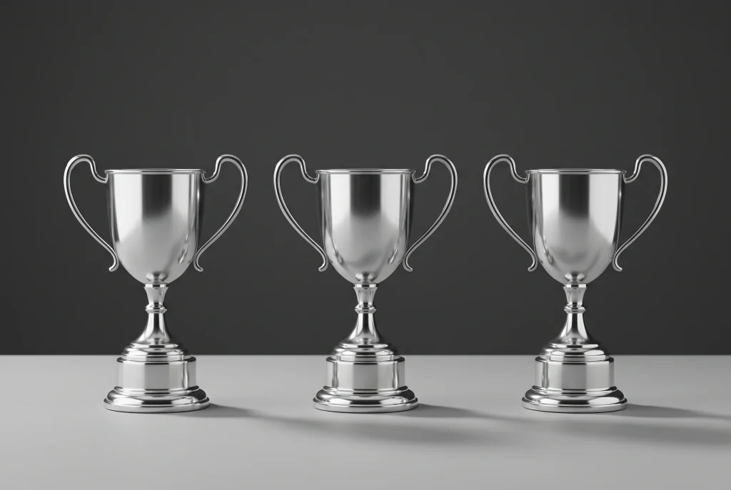 Three F1 trophy podium with three identical trophies side by side representing a tied championship outcome